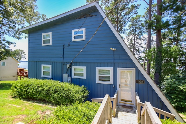 169 N County Road 4945, Etoile, TX 75944 - back of property with board and batten siding