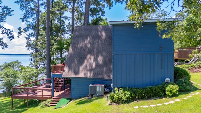 169 N County Road 4945, Etoile, TX 75944 - view of side of property featuring stairs, a wooden deck, a yard, and roof with shingles