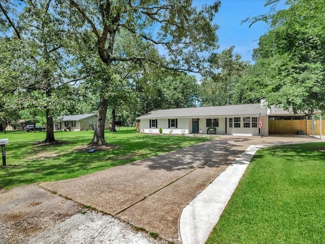 222 Beechnut Cir, Lufkin, TX 75904 - ranch-style home with concrete driveway and a front lawn