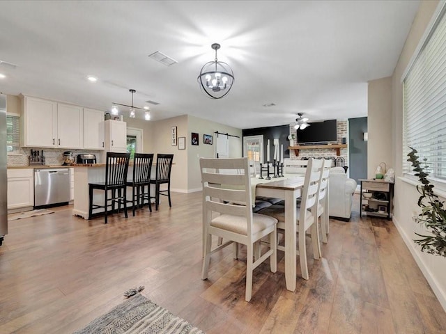 222 Beechnut Cir, Lufkin, TX 75904 - dining area with light wood finished floors, a chandelier, recessed lighting, and ceiling fan