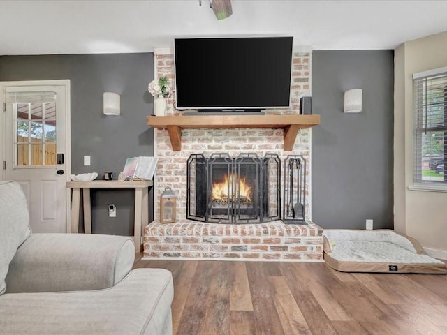 222 Beechnut Cir, Lufkin, TX 75904 - living area featuring wood finished floors and a brick fireplace