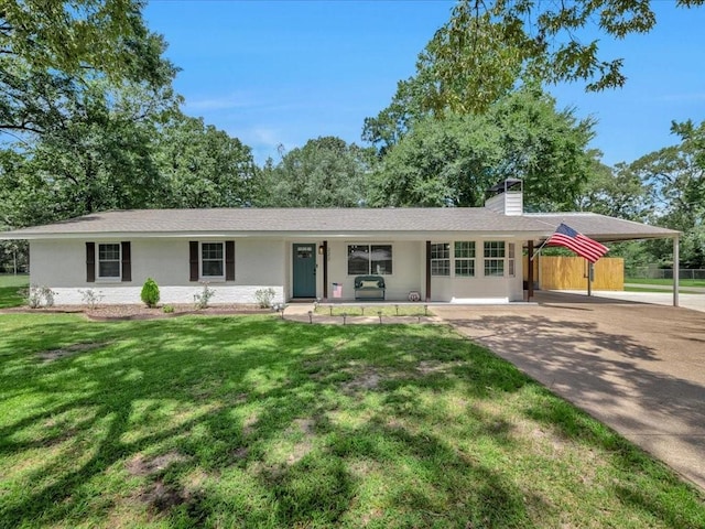 222 Beechnut Cir, Lufkin, TX 75904 - ranch-style house with a chimney, covered porch, a carport, driveway, and stucco siding