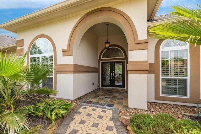 9603 Stonebridge Pl, Tomball, TX 77375 - property entrance featuring french doors, stucco siding, and stone siding