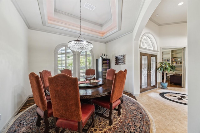 9603 Stonebridge Pl, Tomball, TX 77375 - tiled dining area featuring french doors, a chandelier, and ornamental molding