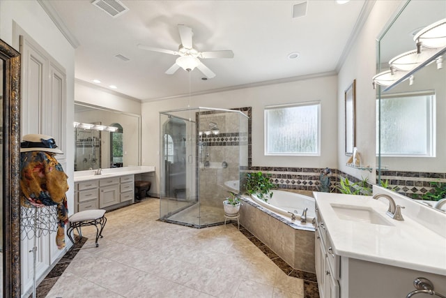 9603 Stonebridge Pl, Tomball, TX 77375 - full bathroom with ornamental molding, a stall shower, two vanities, a garden tub, and ceiling fan