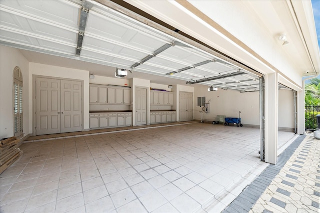 9603 Stonebridge Pl, Tomball, TX 77375 - garage featuring a garage door opener