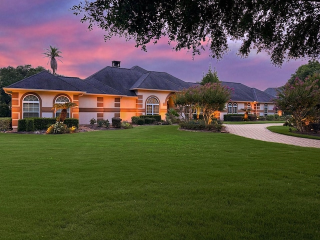 9603 Stonebridge Pl, Tomball, TX 77375 - view of front of house with a lawn, stucco siding, and driveway