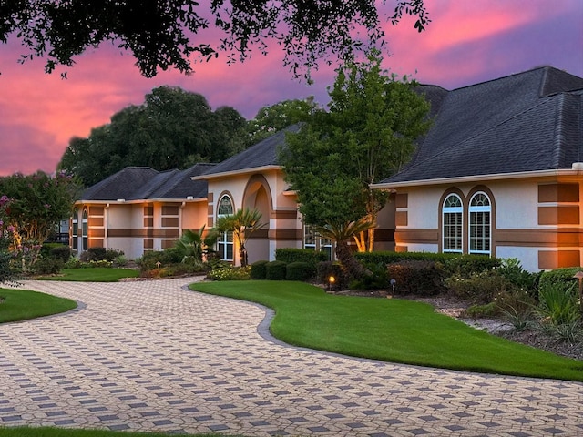 9603 Stonebridge Pl, Tomball, TX 77375 - view of front of house featuring stucco siding and a yard