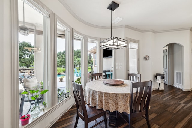 9603 Stonebridge Pl, Tomball, TX 77375 - dining area featuring arched walkways, healthy amount of natural light, ornamental molding, and dark wood-type flooring