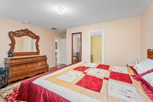 16307 Melody View Ct, Cypress, TX 77429 - bedroom featuring a textured ceiling and wood finished floors