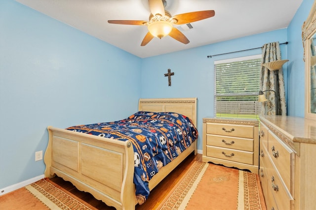 16307 Melody View Ct, Cypress, TX 77429 - bedroom with ceiling fan and light wood finished floors