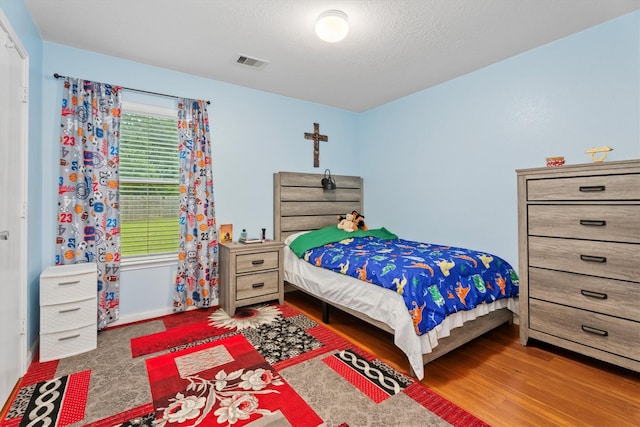 16307 Melody View Ct, Cypress, TX 77429 - bedroom featuring wood finished floors and baseboards
