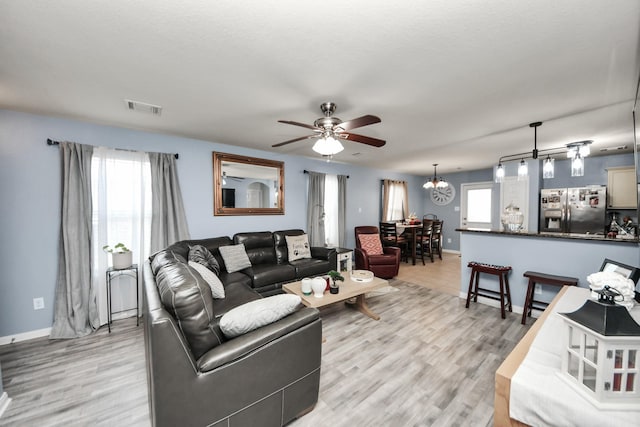 28961 San Bernard River Loop, Spring, TX 77386 - living area with plenty of natural light, ceiling fan, and light wood finished floors