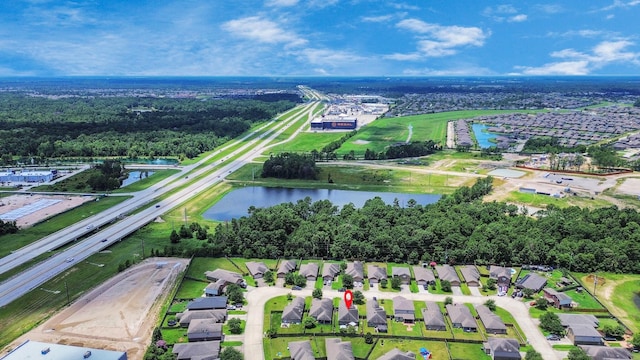 28961 San Bernard River Loop, Spring, TX 77386 - aerial view of property and surrounding area with a large body of water and nearby suburban area