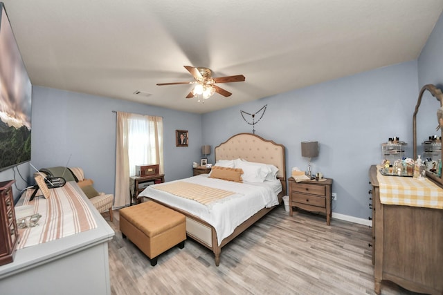 28961 San Bernard River Loop, Spring, TX 77386 - bedroom with light wood finished floors and ceiling fan