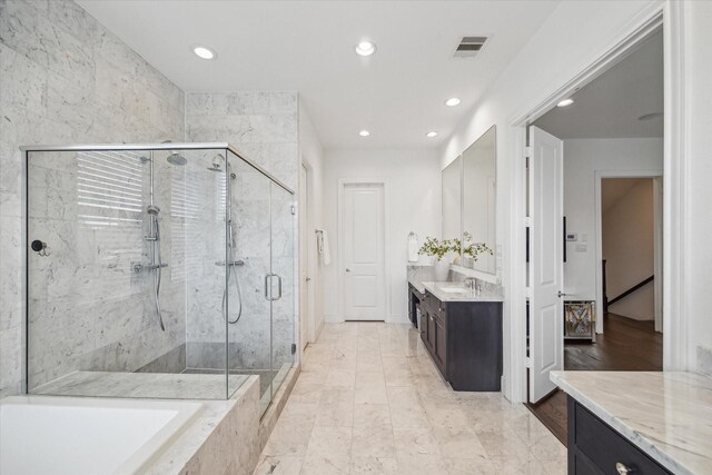 3410 Timbergrove Heights St, Houston, TX 77008 - full bathroom featuring vanity, a marble finish shower, a garden tub, and recessed lighting