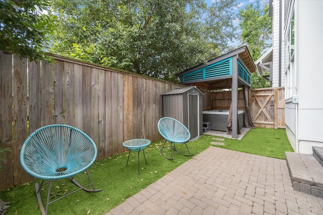 3410 Timbergrove Heights St, Houston, TX 77008 - fenced backyard with a patio area, a storage unit, and a gate