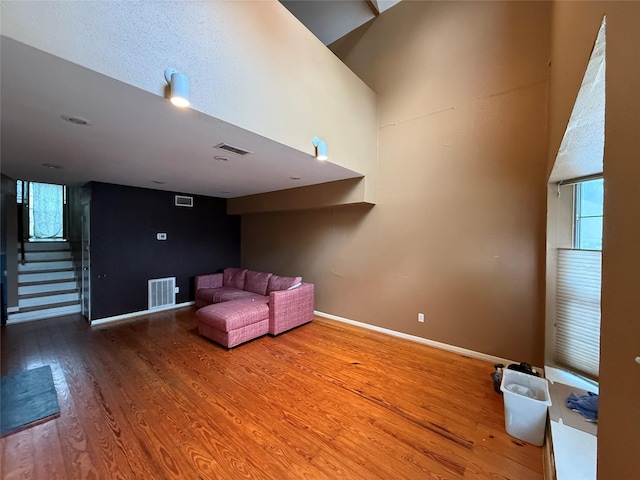 1226 W Drew St Unit B, Houston, TX 77006 - sitting room featuring wood finished floors and stairway