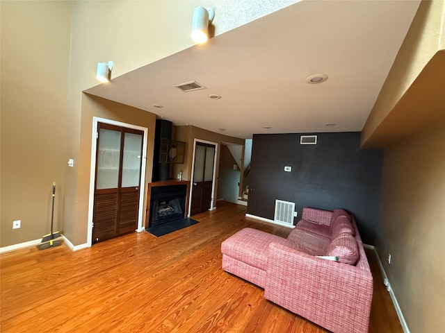 1226 W Drew St Unit B, Houston, TX 77006 - sitting room with light wood-type flooring and a fireplace