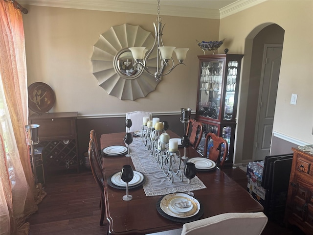 4714 Loggia Ln, Humble, TX 77396 - dining room with ornamental molding, arched walkways, wood finished floors, and a chandelier