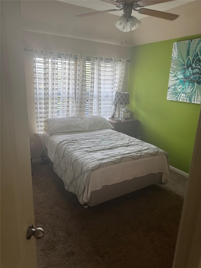 4714 Loggia Ln, Humble, TX 77396 - carpeted bedroom featuring baseboards and a ceiling fan