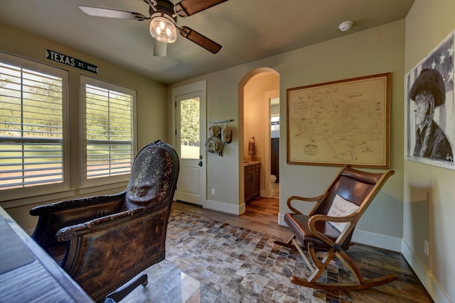 39577 Mesquite Dr, Hempstead, TX 77445 - home office featuring arched walkways, a ceiling fan, and wood finished floors