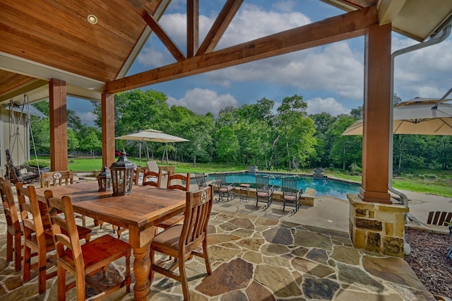 39577 Mesquite Dr, Hempstead, TX 77445 - view of patio / terrace with an outdoor pool, view of scattered trees, and outdoor dining space