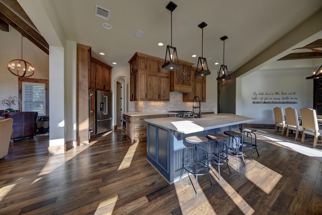 39577 Mesquite Dr, Hempstead, TX 77445 - kitchen featuring high end fridge, light countertops, dark wood-style flooring, decorative backsplash, and a chandelier