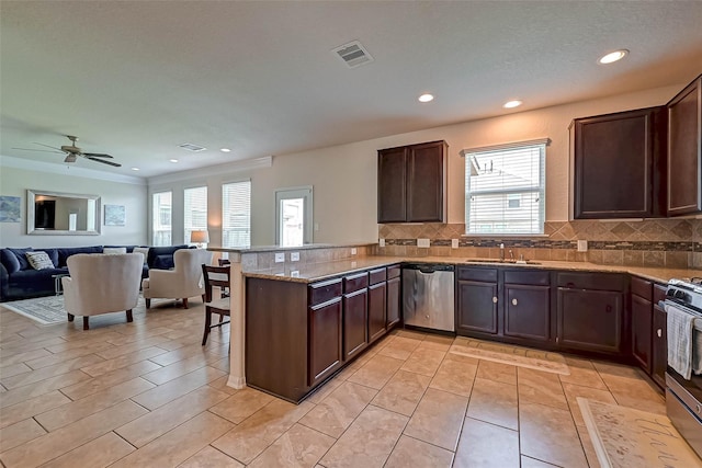 3306 Coopers Ridge Way, Houston, TX 77084 - kitchen featuring appliances with stainless steel finishes, plenty of natural light, open floor plan, decorative backsplash, and recessed lighting