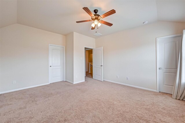 3306 Coopers Ridge Way, Houston, TX 77084 - unfurnished bedroom with lofted ceiling, light carpet, and a ceiling fan