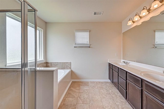 3306 Coopers Ridge Way, Houston, TX 77084 - bathroom featuring double vanity, a bath, and a shower with door
