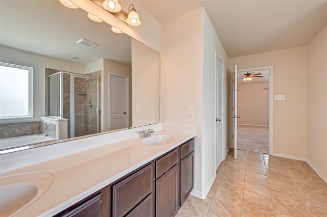 3306 Coopers Ridge Way, Houston, TX 77084 - full bathroom with double vanity, a bath, a shower stall, a ceiling fan, and tile patterned flooring