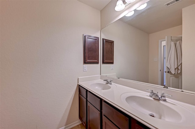 3306 Coopers Ridge Way, Houston, TX 77084 - bathroom featuring double vanity and baseboards