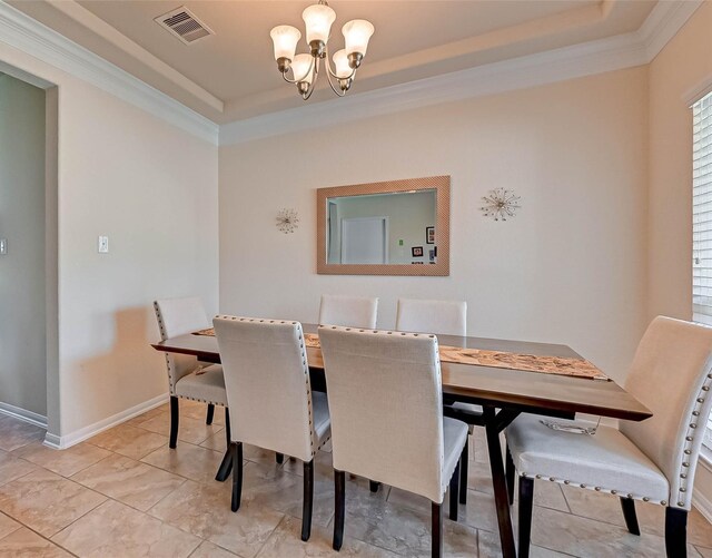 3306 Coopers Ridge Way, Houston, TX 77084 - dining space with crown molding, a raised ceiling, a chandelier, and light tile patterned floors