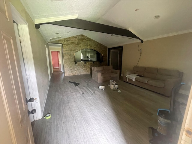 26603 N Marek Ln, Magnolia, TX 77355 - unfurnished living room with wood finished floors, lofted ceiling, brick wall, and crown molding