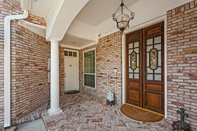 15 S Lakemist Harbour Pl, The Woodlands, TX 77381 - entrance to property featuring a porch and brick siding