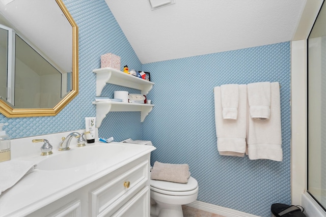 15 S Lakemist Harbour Pl, The Woodlands, TX 77381 - bathroom featuring wallpapered walls, vaulted ceiling, vanity, and a shower with door
