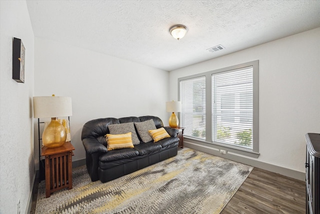 8218 Waynemer Way, Houston, TX 77040 - living area with wood finished floors and a textured ceiling