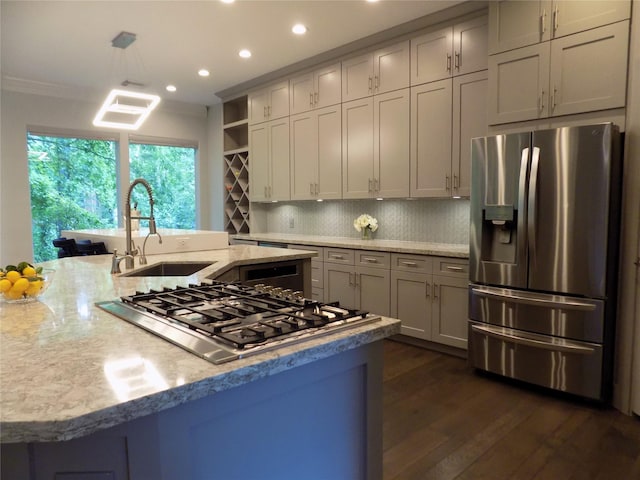 12636 Briar Patch Rd, Houston, TX 77077 - kitchen featuring stainless steel appliances, decorative backsplash, recessed lighting, dark wood finished floors, and light stone countertops