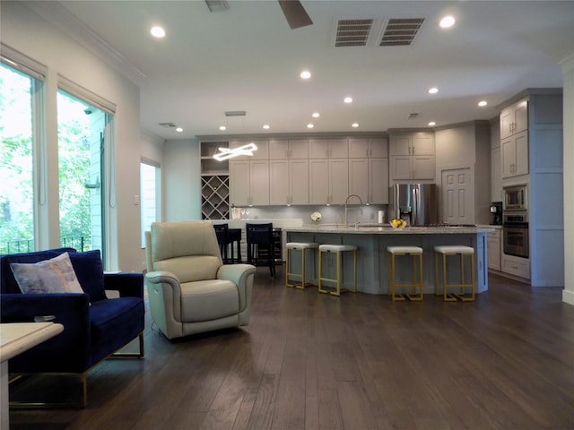 12636 Briar Patch Rd, Houston, TX 77077 - living room featuring ornamental molding, dark wood finished floors, and recessed lighting