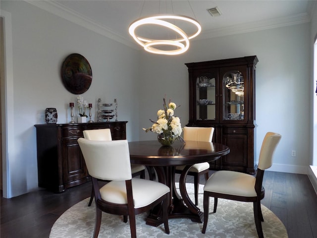 12636 Briar Patch Rd, Houston, TX 77077 - dining area with a chandelier, dark wood-style floors, and crown molding