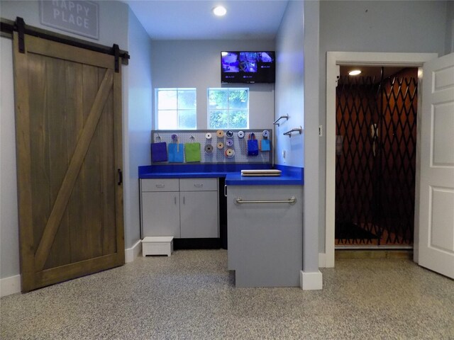 12636 Briar Patch Rd, Houston, TX 77077 - bar featuring a barn door, recessed lighting, and speckled floor