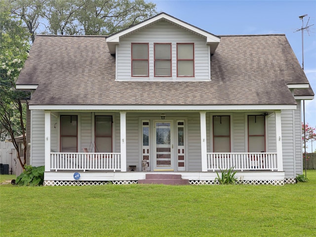 1233 Eagle Lake Rd, Sealy, TX 77474 - view of front facade featuring covered porch, roof with shingles, and a front yard