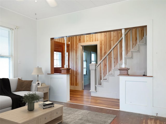 1233 Eagle Lake Rd, Sealy, TX 77474 - living area featuring healthy amount of natural light, stairway, and wood finished floors