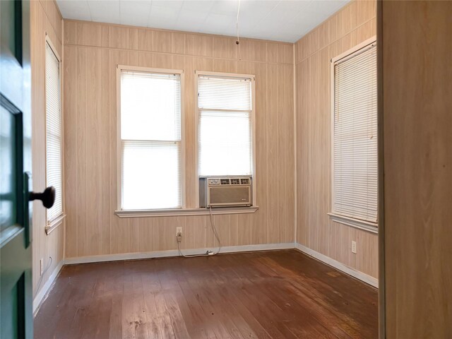 1233 Eagle Lake Rd, Sealy, TX 77474 - spare room with cooling unit, dark wood finished floors, and wooden walls