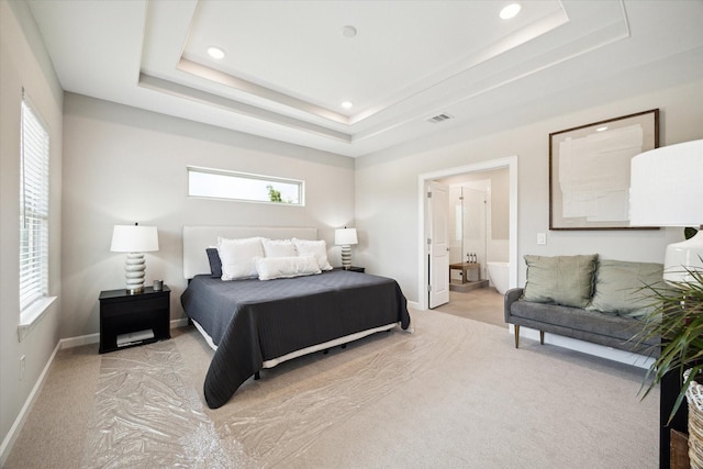 6024 T C Jester Blvd, Houston, TX 77091 - bedroom with light carpet, recessed lighting, connected bathroom, and a raised ceiling