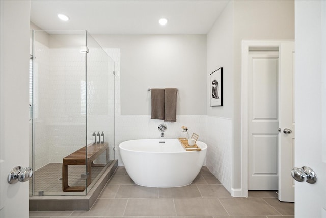 6024 T C Jester Blvd, Houston, TX 77091 - bathroom featuring a shower stall, a freestanding bath, tile patterned floors, wainscoting, and recessed lighting
