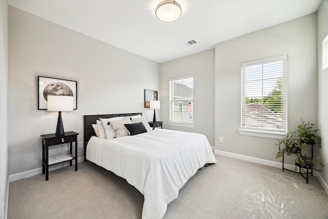 6024 T C Jester Blvd, Houston, TX 77091 - bedroom with light colored carpet and baseboards