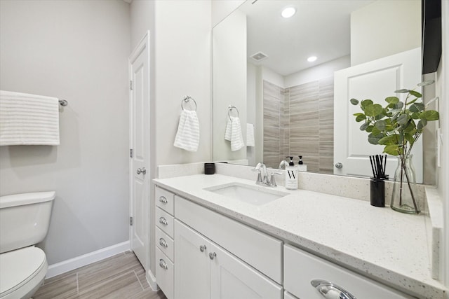 6024 T C Jester Blvd, Houston, TX 77091 - bathroom with vanity, recessed lighting, and wood finished floors