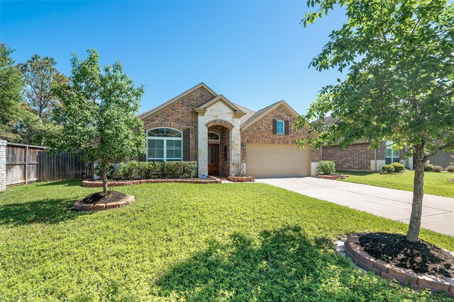 15218 Zenith Glen Ln, Cypress, TX 77429 - view of front of house featuring brick siding, concrete driveway, and an attached garage